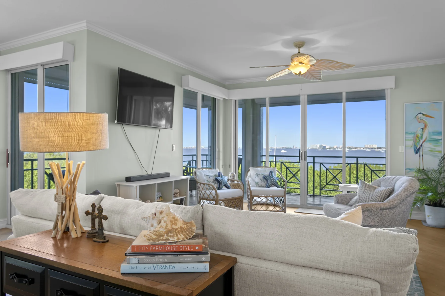 Living room at 4717 Dolphin Cay Ln S #202 with wide Boca Ciega Bay views