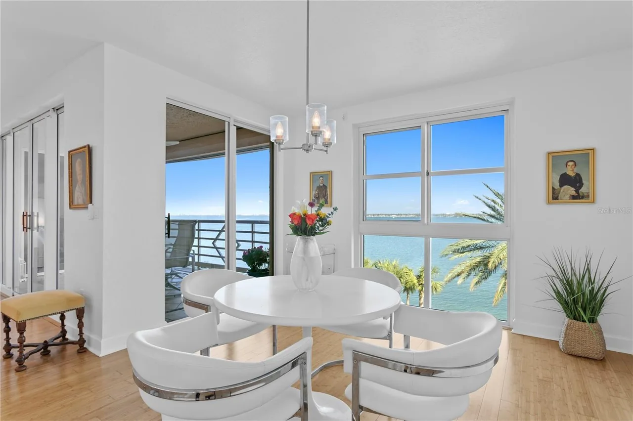 Dining area at 4993 Bacopa Ln S #304 overlooking Boca Ciega Bay